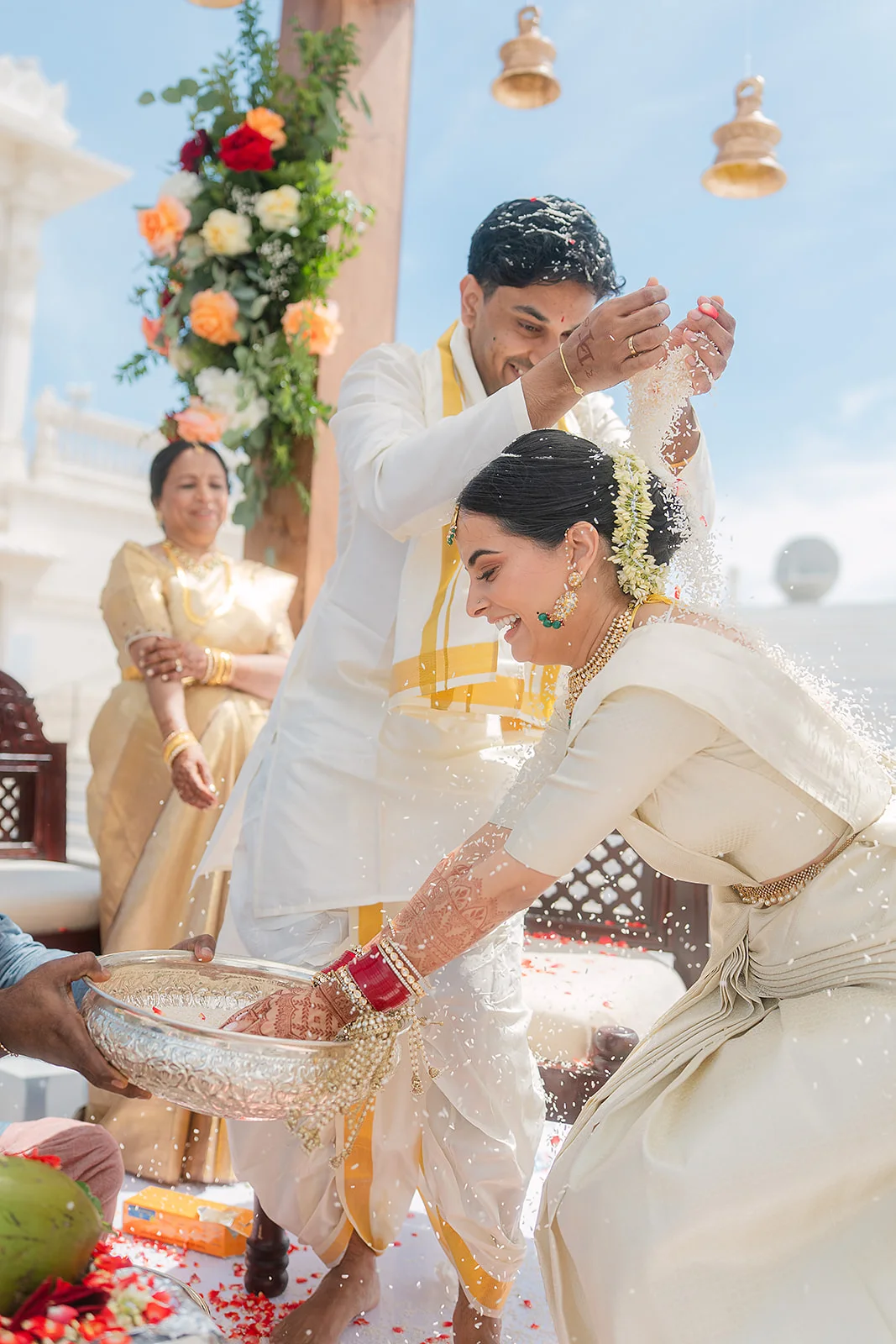 Couple and loved ones sharing a wedding ritual
